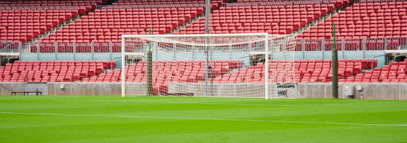 A goal at the end of a football pitch.