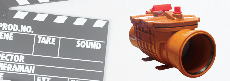 A film clapperboard and an orange flood valve.