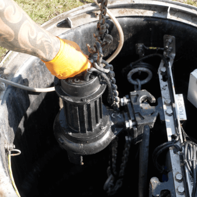 T-T service engineers performing a service on a package pumping station