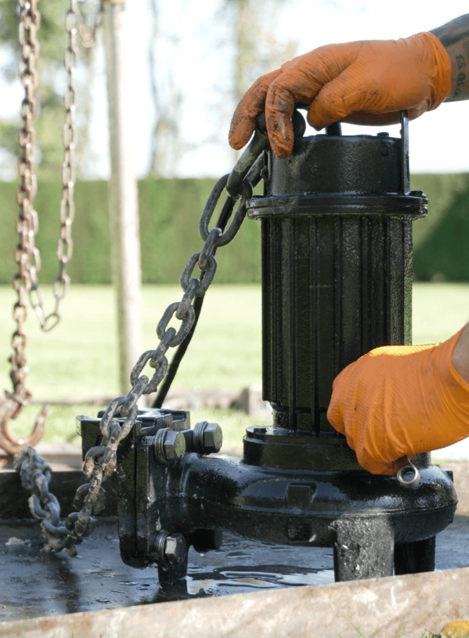 Engineers servicing a pumping station control panel