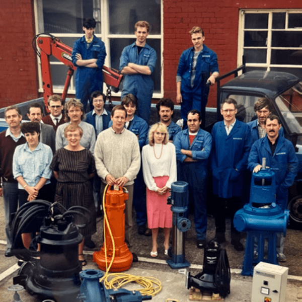 An old photo of the T-T team with a young Heather at the front.