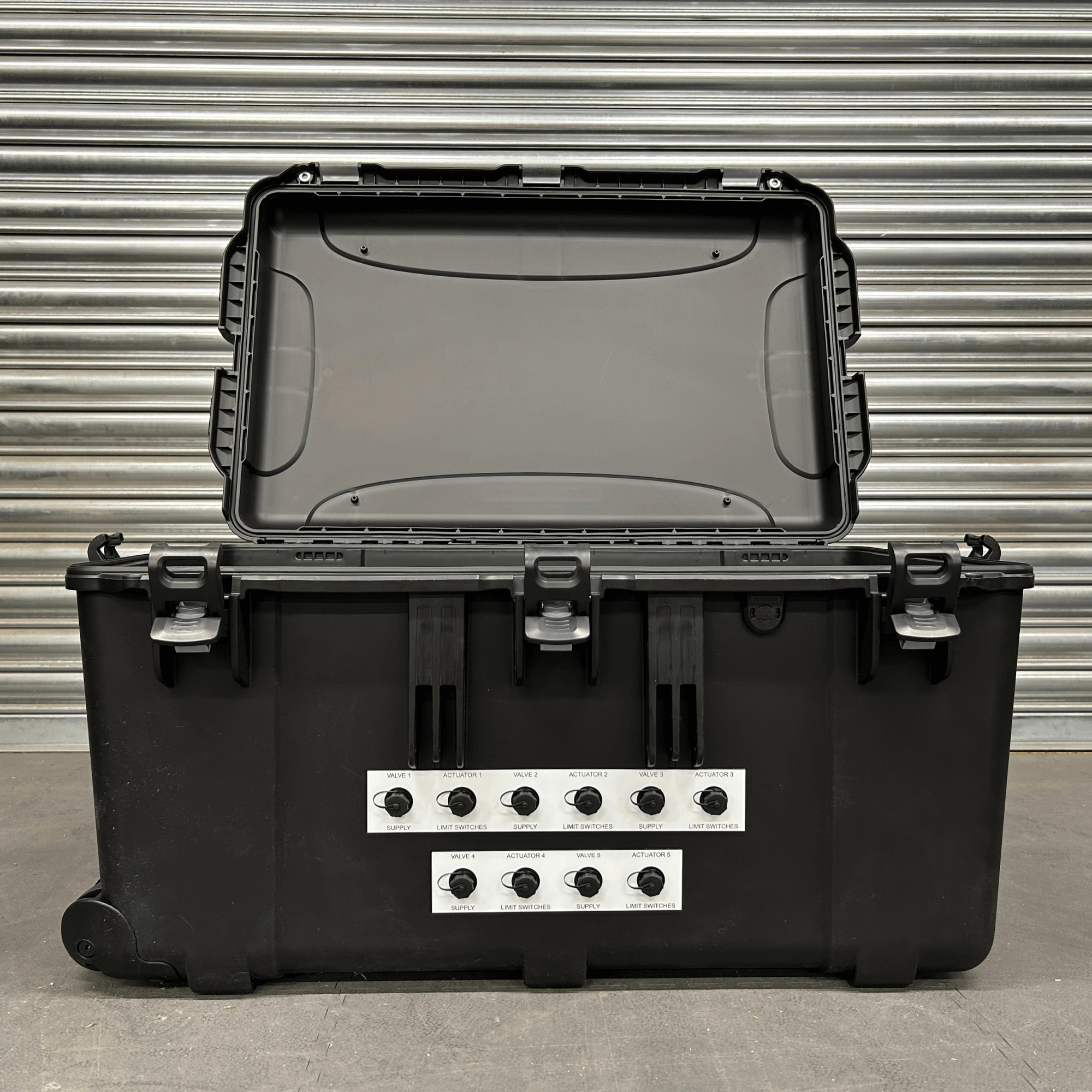 Front of carry case with controls and indicators.