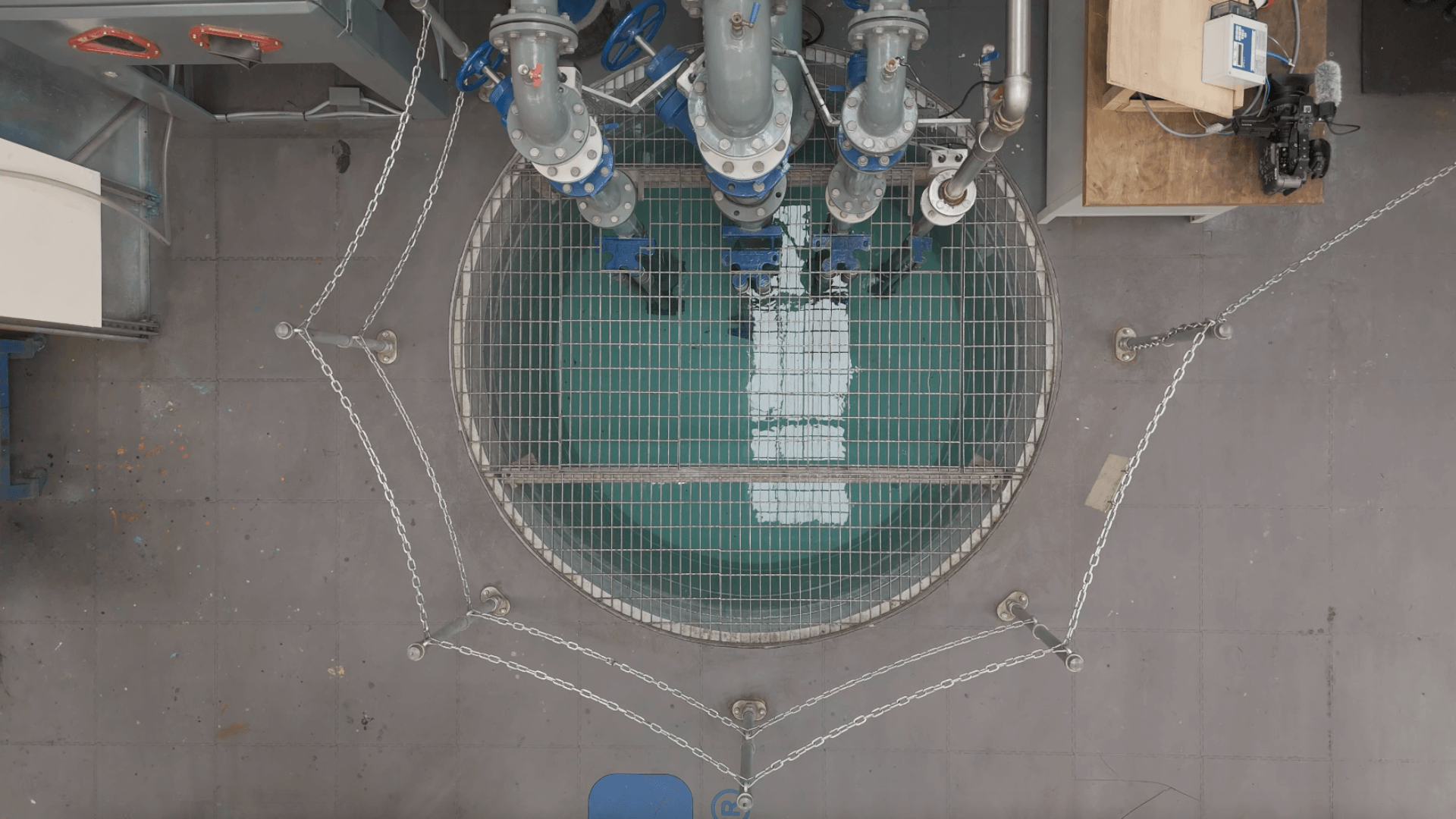 Birdseye photo of dirty water test tank.