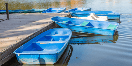 Boats and a jetty on a lake.