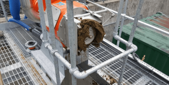 Screw press separator producing dry slurry materials.